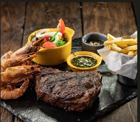 Ribeye con langostinos
